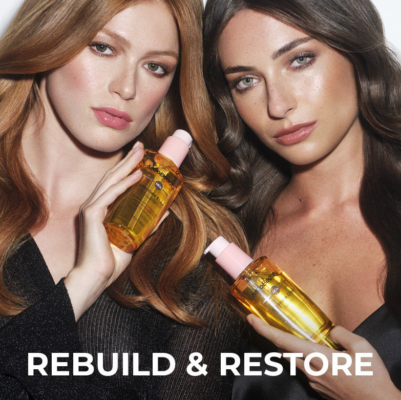 Rebuild & restore. 2 women holding bottles of ultimate elixir. 