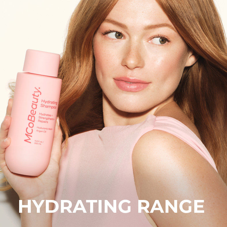 Hydrating range. Women holding bottle of ultimate elixir. 