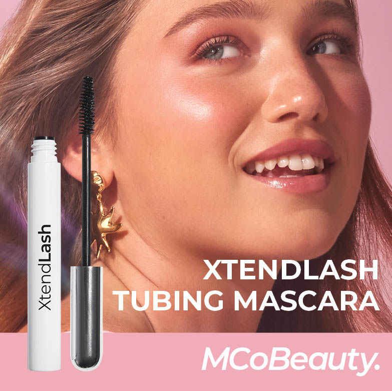 XtendLash tubing Mascara. Woman looking over her shoulder smiling. MCoBeauty logo.