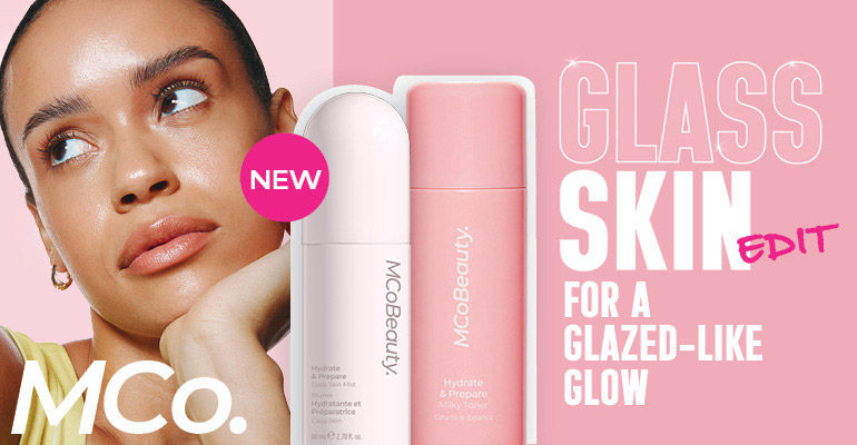 MCoBeauty logo. Woman looking up and right. New Glass skin edit for a glazed-lie glow.